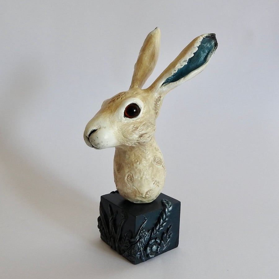 Hare Sculpture displayed on a plaster & clay plinth