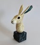 Hare Sculpture displayed on a plaster & clay plinth