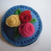 Pale blue Circle Brooch with rolled flower Trio