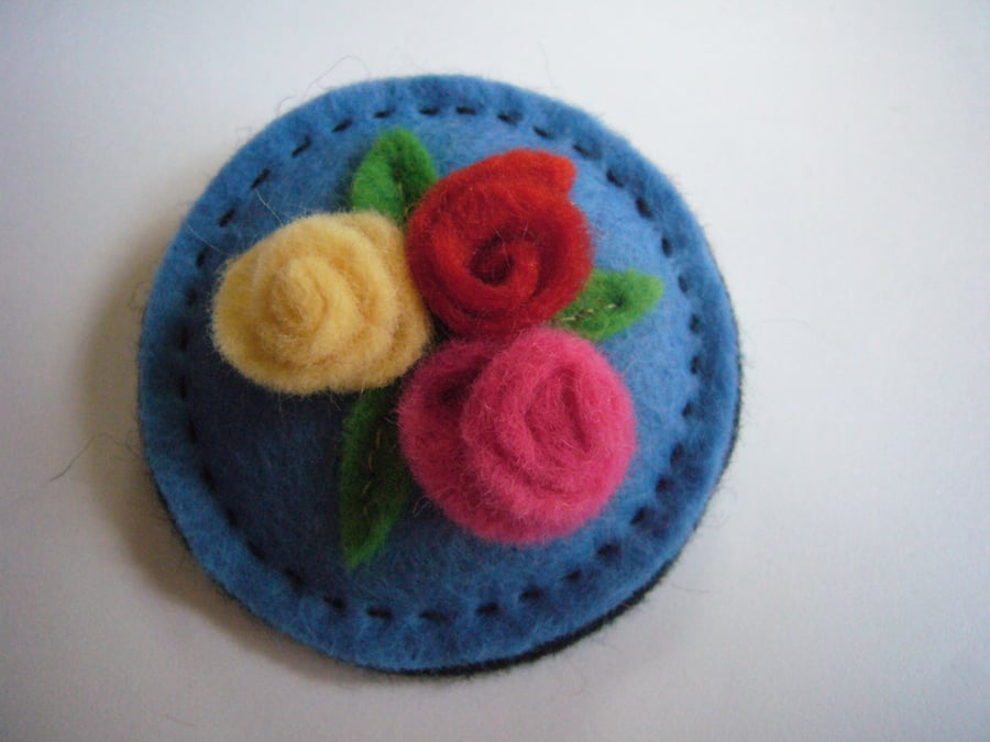 Pale blue Circle Brooch with rolled flower Trio