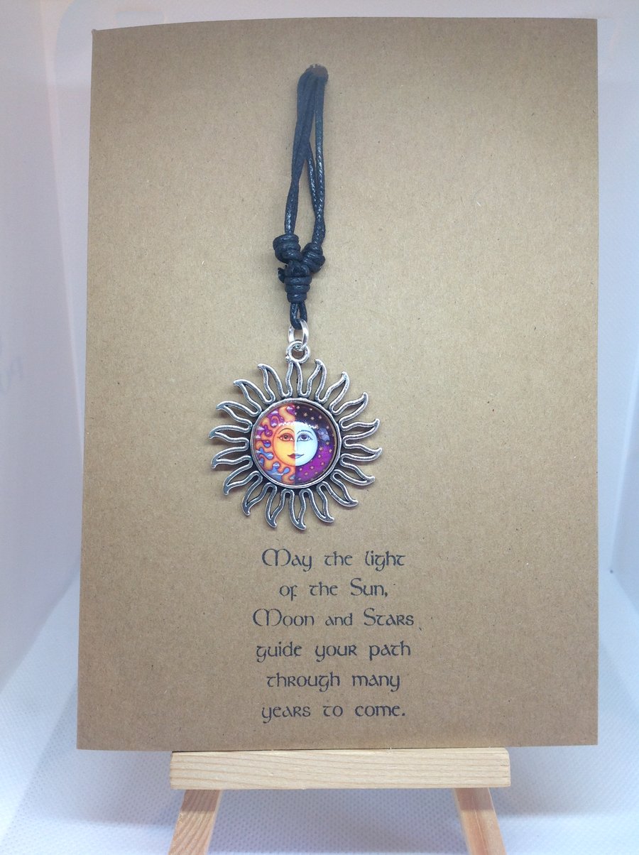 Hand made necklace on leather thong, attached to hand stamped greetings card