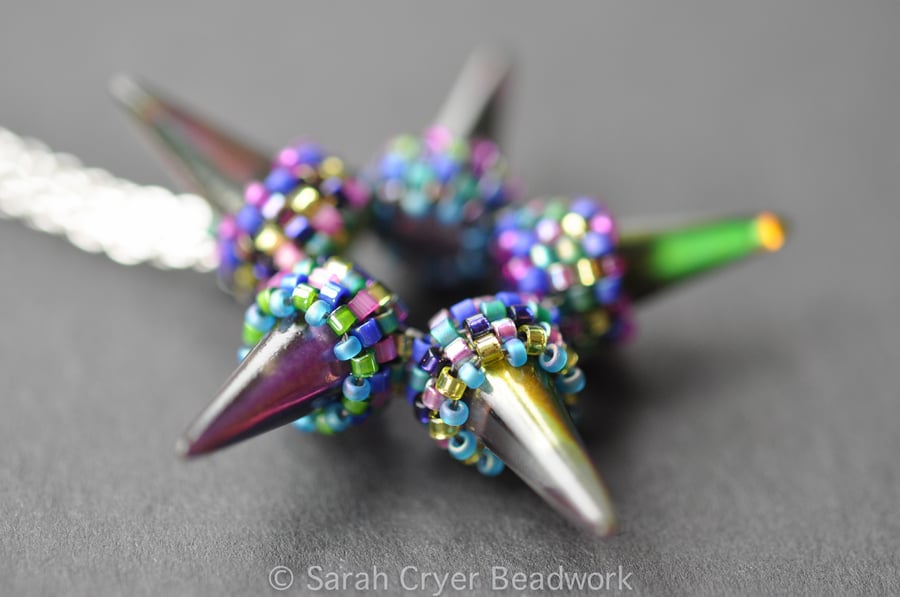 Beadwoven petrol spike star pendant