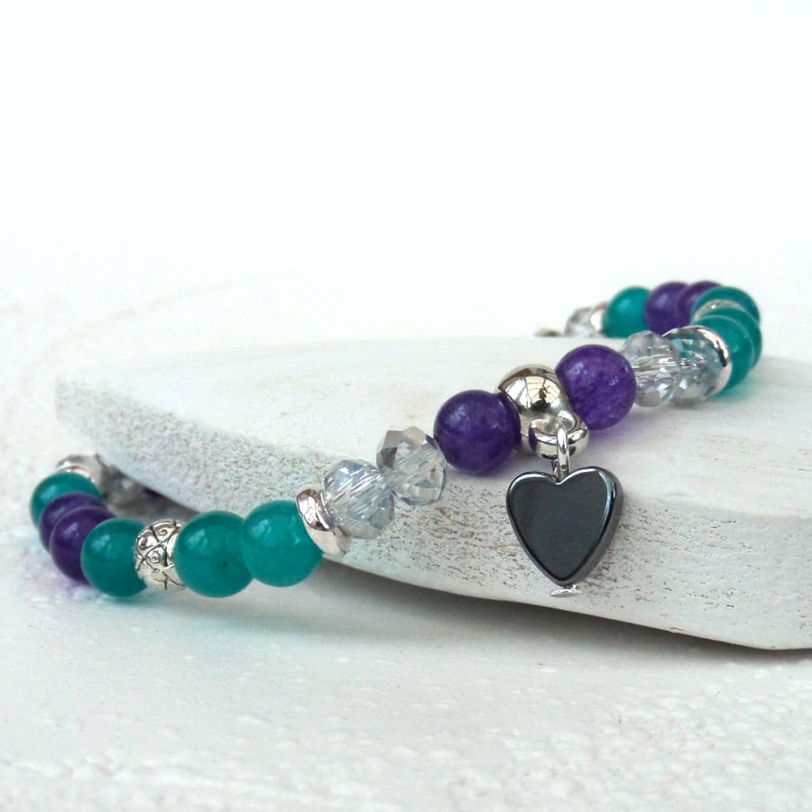 Dainty green and purple stretchy bracelet with heart charm embellishment