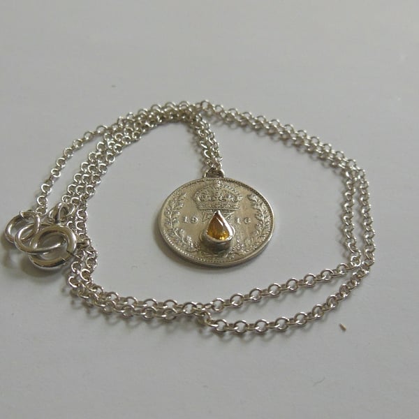 1916 threepence set with golden yellow sapphire