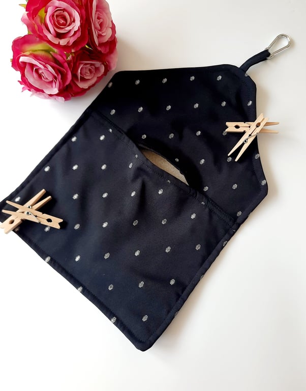 Black and silver embroidered dotty clip on pag bag.