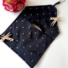 Black and silver embroidered dotty clip on pag bag.