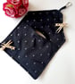 Black and silver embroidered dotty clip on pag bag.