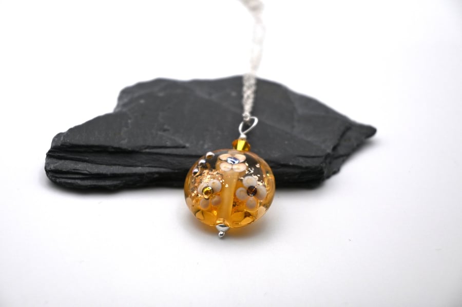 lampwork glass amber and gold glitter flower pendant necklace