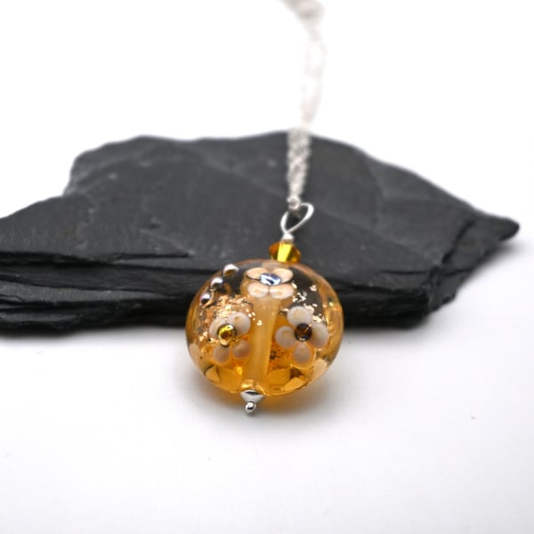 lampwork glass amber and gold glitter flower pendant necklace