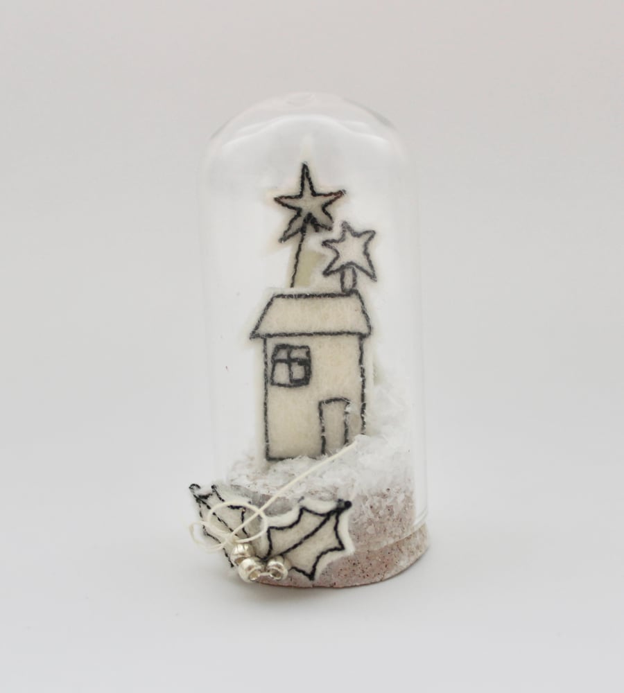 A Miniature Snowy Scene within a Glass Dome