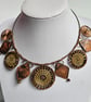 Necklace featuring Dorset Buttons with copper pendants and beads