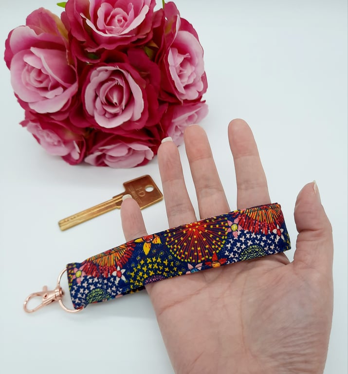Navy and raspberry pink dandelion burst keyfob wristlet,  keyring. 