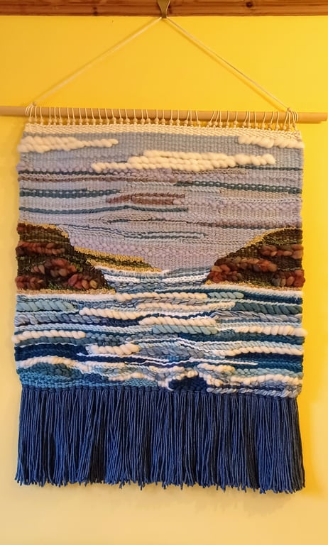 Woven wall hanging of bay and headland