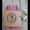 Pretty pink hand knitted bow scarf 