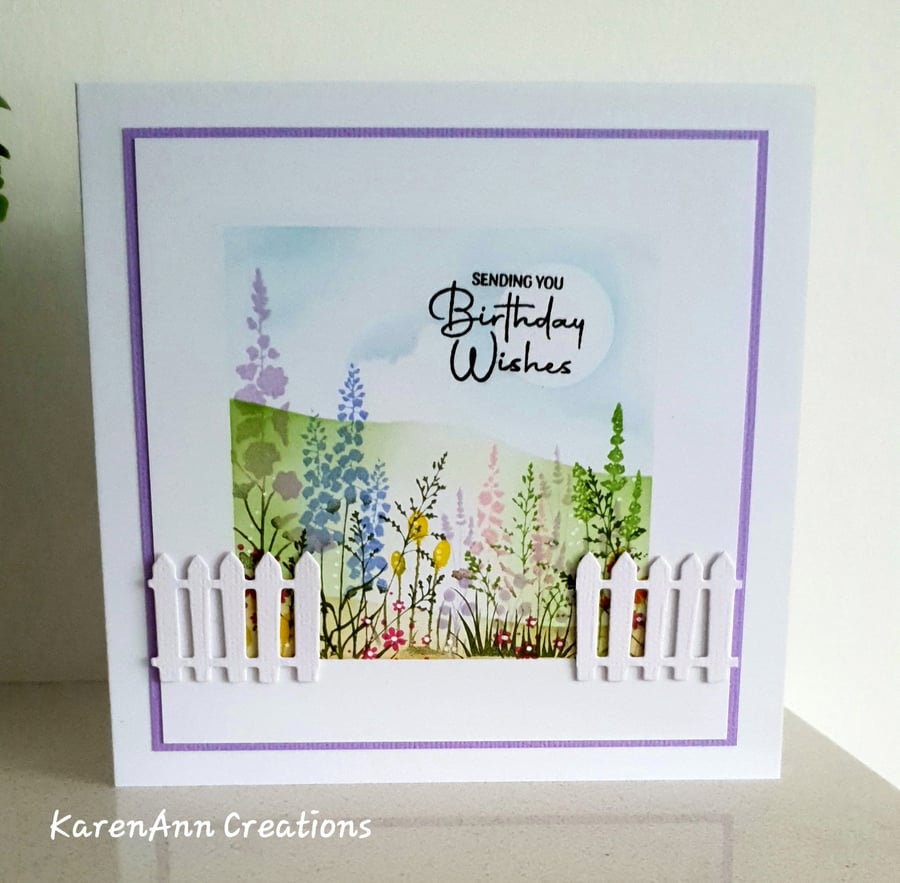Spring flowers scene female birthday card