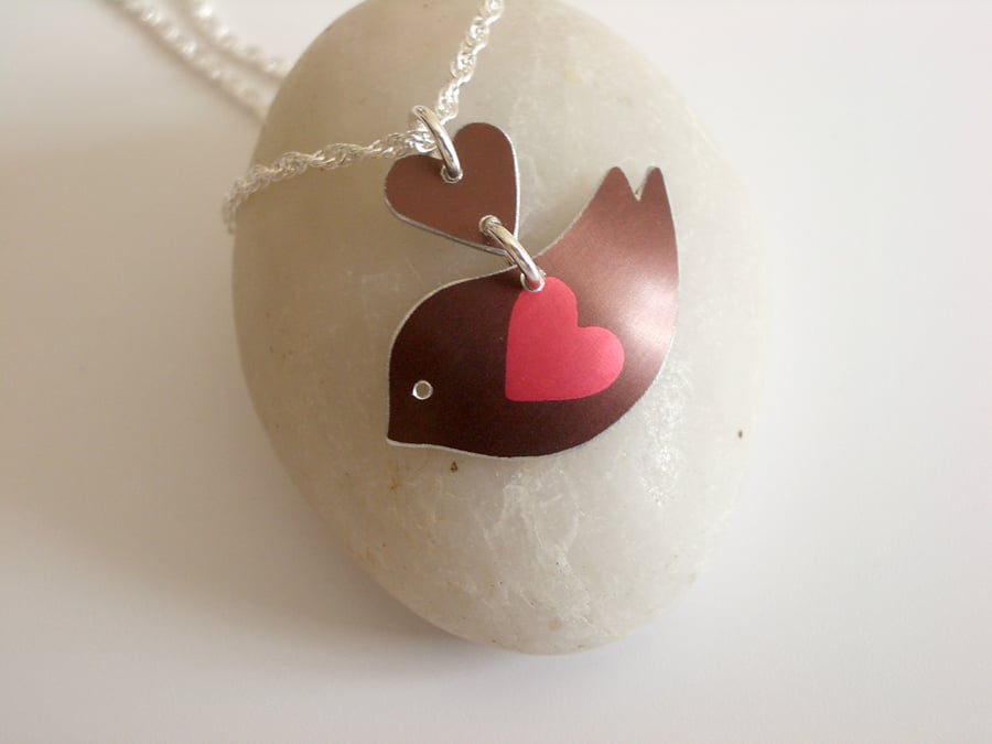 Bird pendant necklace in brown with red heart wing