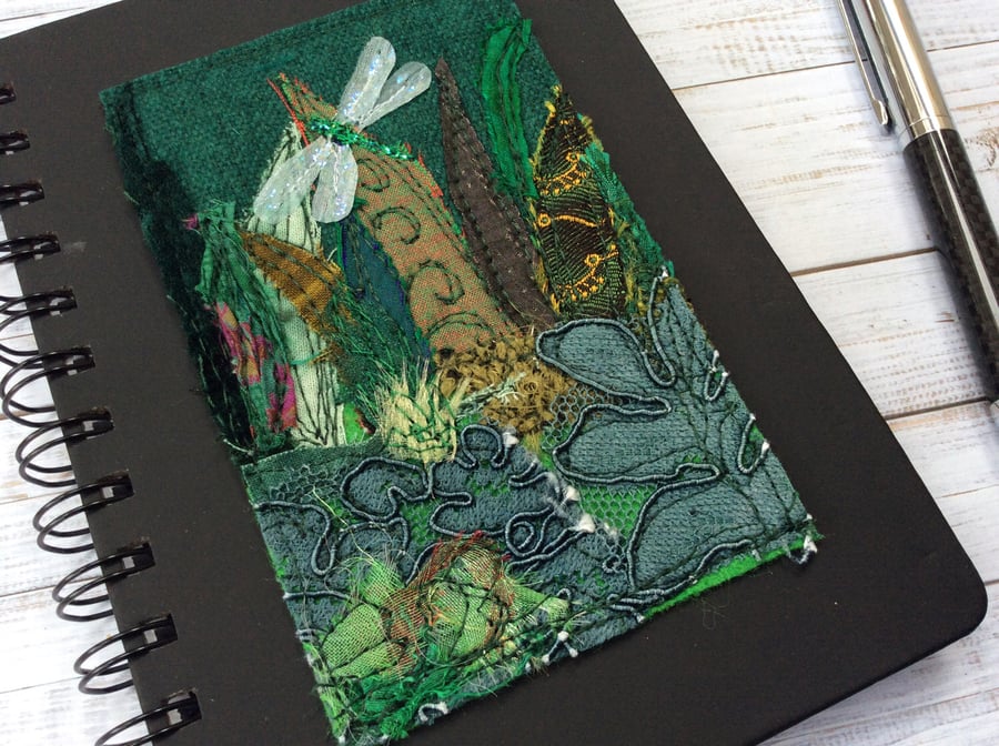 Embroidered dragonfly with garden plants notebook or journal. 