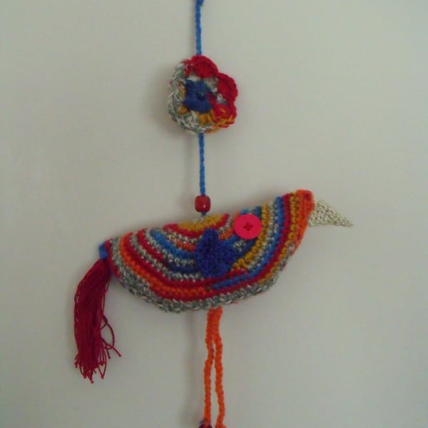 bright colourful crocheted hanging bird decoration for your wall or twig tree