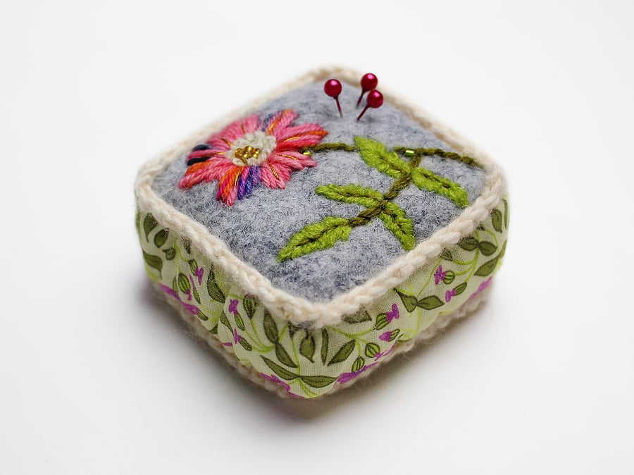 Pin cushion in grey felt with hand embroidered dog rose
