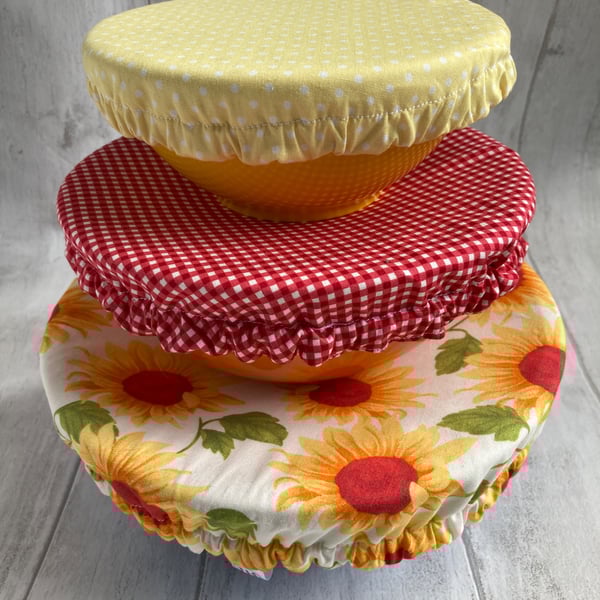 Reusable bowl covers - set of three. Sunflowers, reds and yellows.
