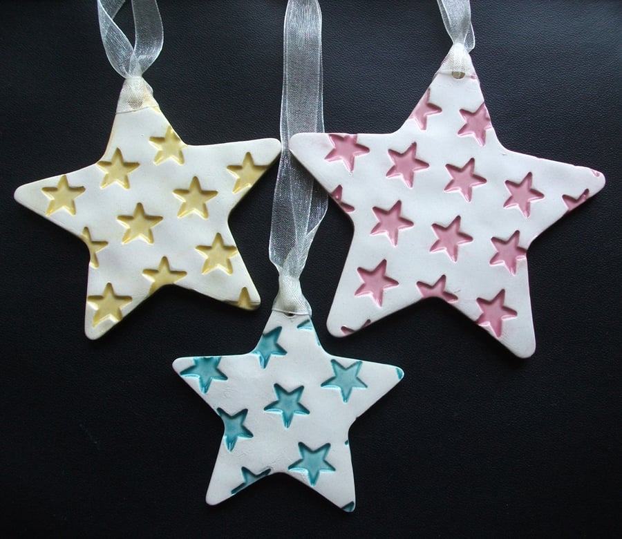 Set of three ceramic star decorations