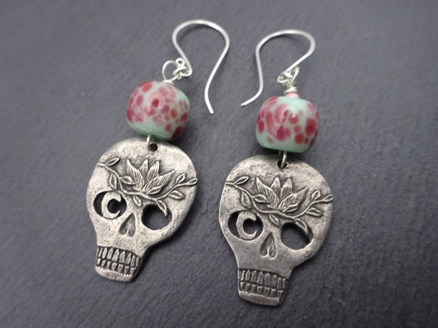 green and pink lampwork glass skull earrings