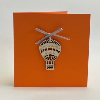 'Anniversary wishes' card with detachable decoration