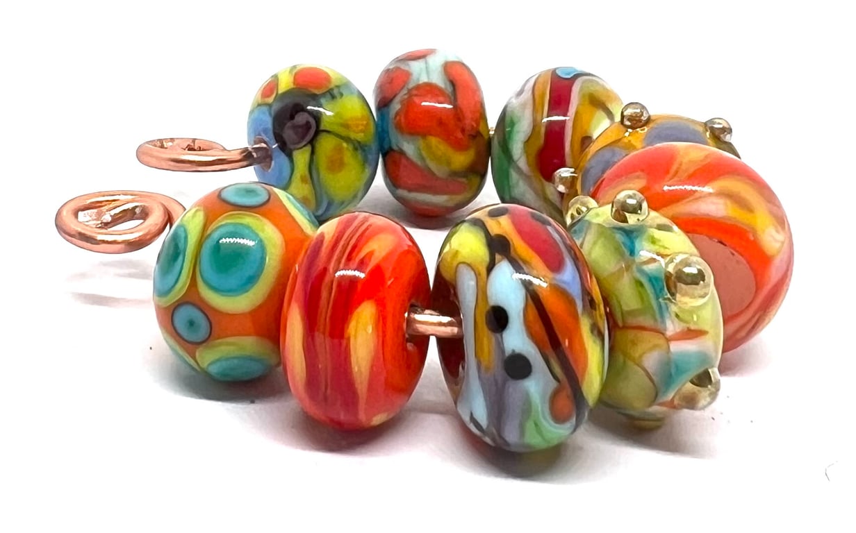 Handcrafted Lamp work glass Beads – Bullseye Dots & orange Psychedelic Swirls 
