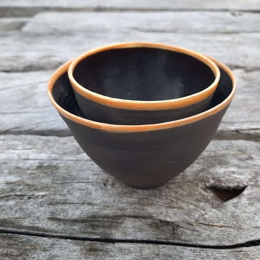 Two small black ceramic nesting bowl set