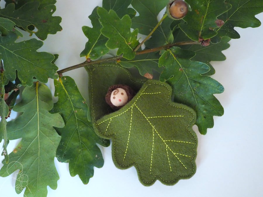 Acorn doll in an oak leaf