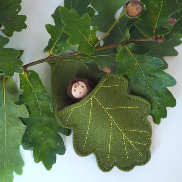 Acorn doll in an oak leaf