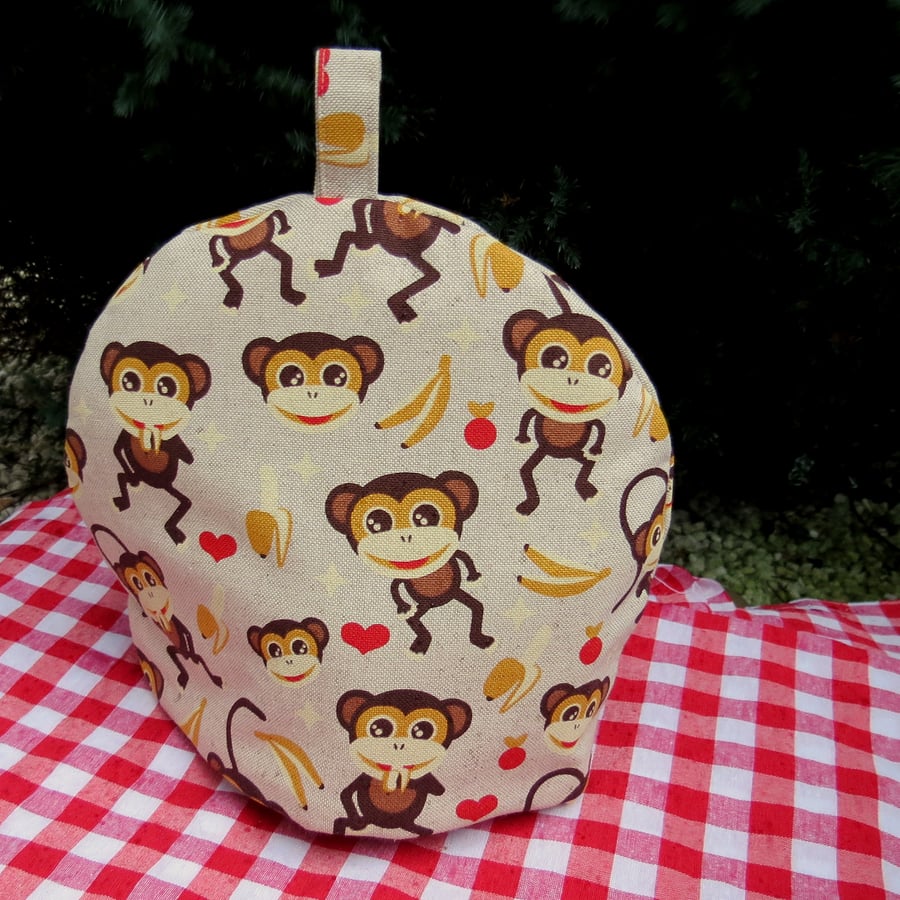 Monkeys.  A small tea cosy, made to fit a two cup teapot.  