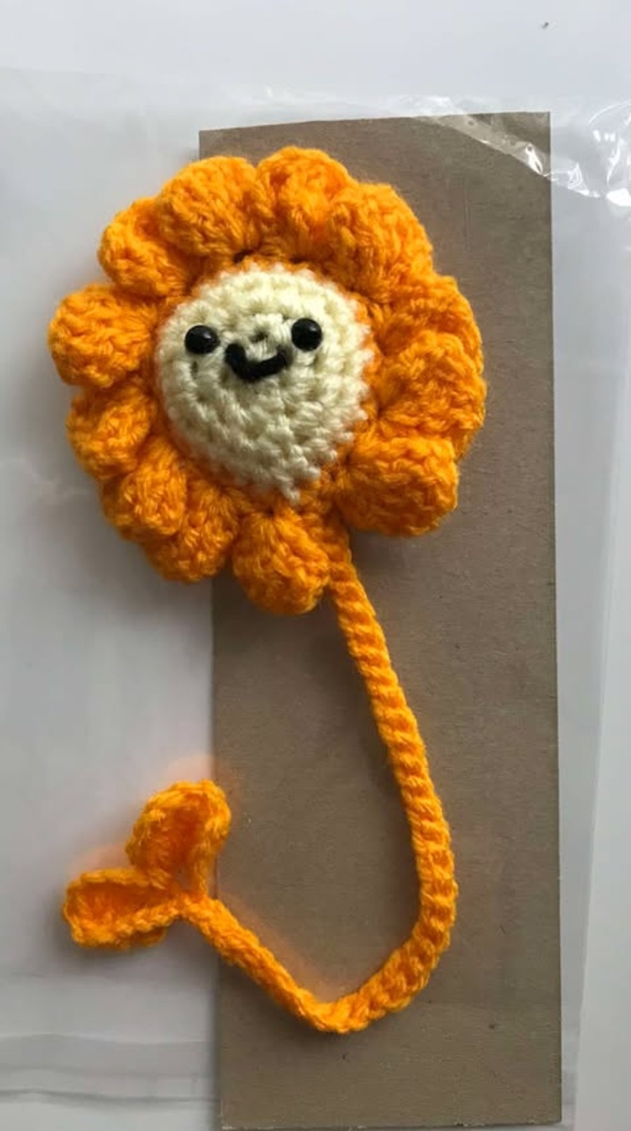 Crocheted Orange flower bookmark with a  bow