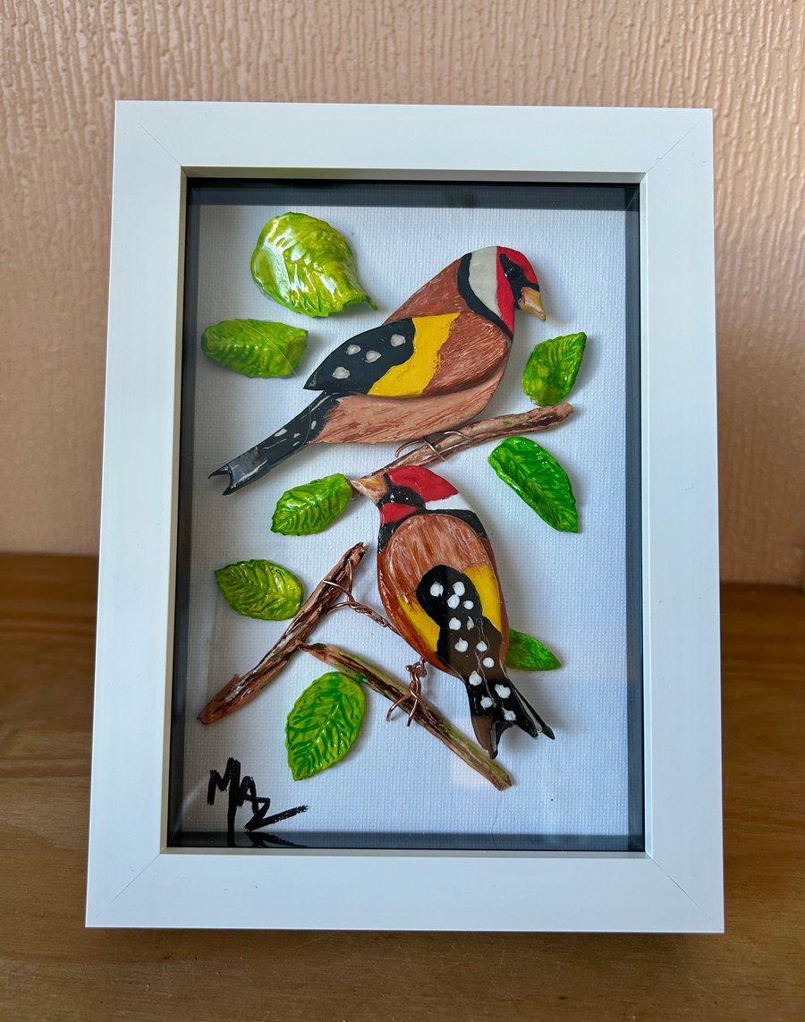 Pair of Goldfinches amongst leaves and twigs , ideal gift or home decor 