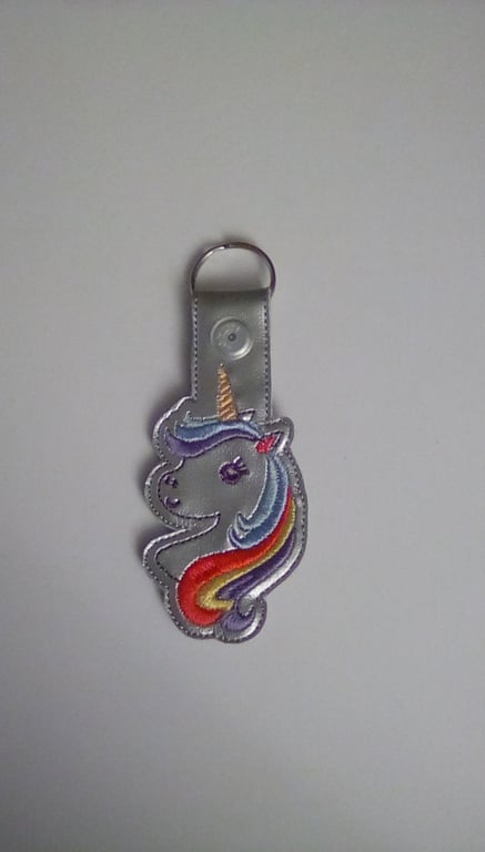 665. Unicorn keyring.