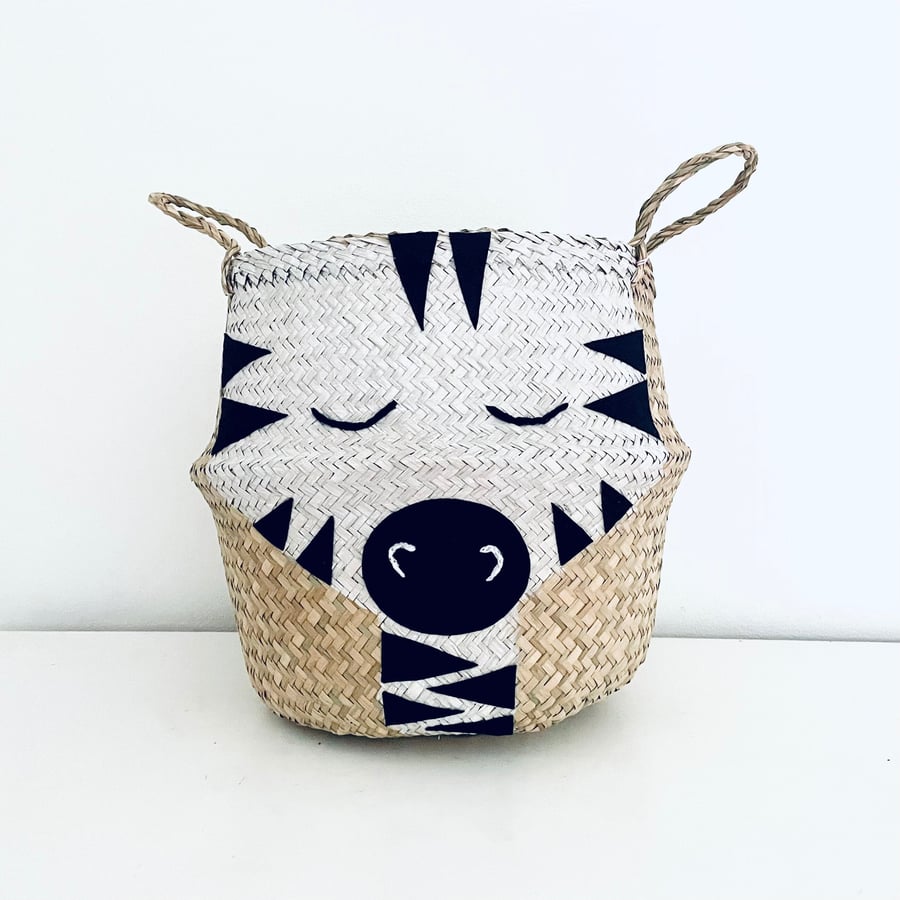Zebra belly basket with a beautiful painted and embroidered face. 