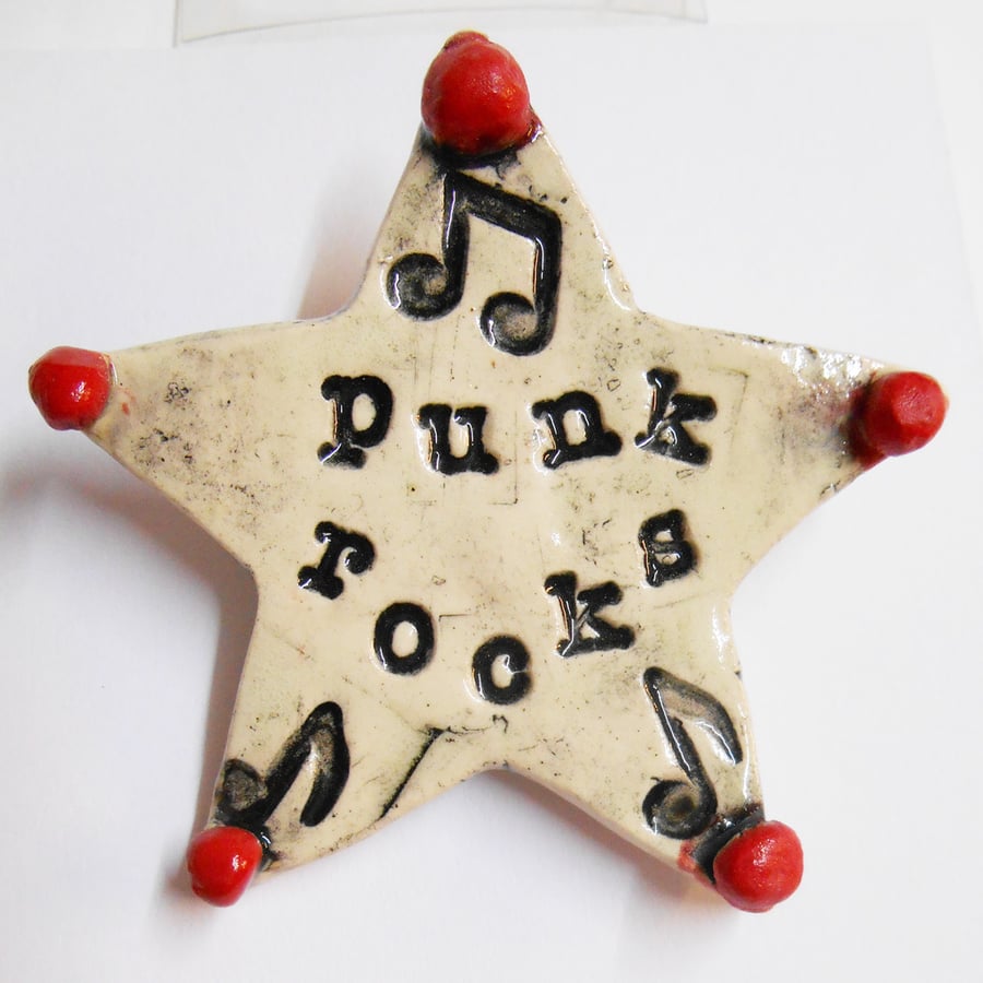 Buttons Punk Rocks Badge Star Design on white Porcelain.