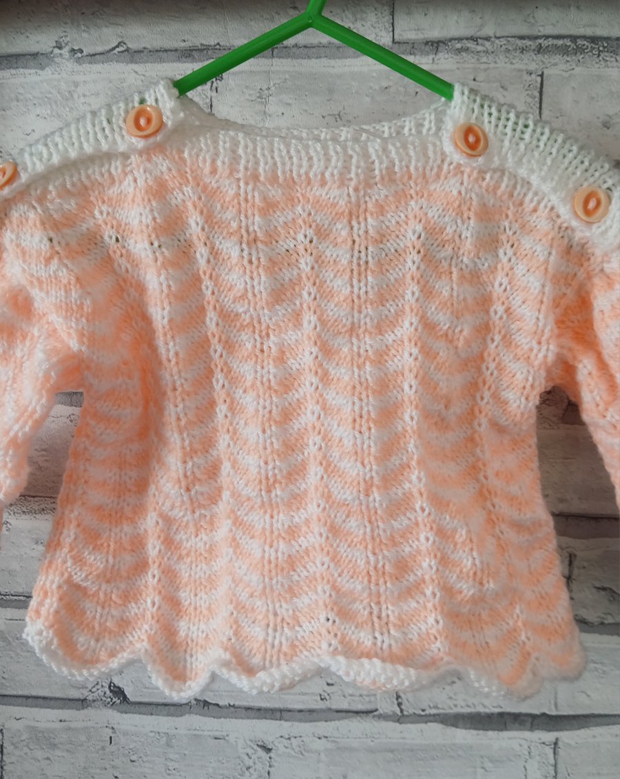 Hand-knitted baby jumper.  Approx 3 to 6 months. Price includes P and P. 