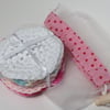 Eight cotton, reusable, pastel coloured make up face wipes with net washbag