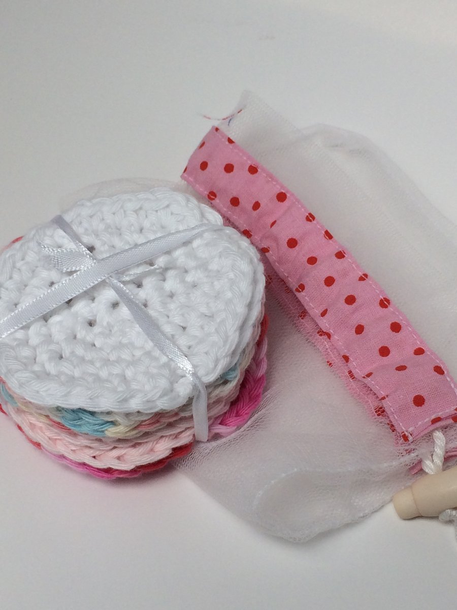 Eight cotton, reusable, pastel coloured make up face wipes with net washbag