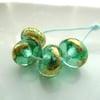 green and gold leaf lampwork beads