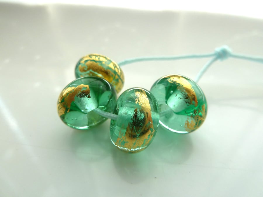 green and gold leaf lampwork beads