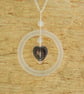 Glass ring pendant with black patterned heart - Image 1