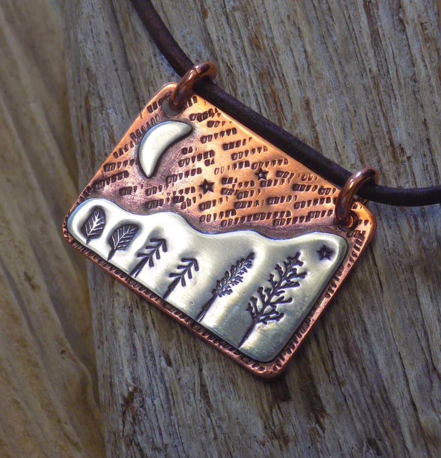 Copper and silver 'celestial forest' mixed metals scene pendant