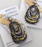 Embroidered Shell Pendant with Yellow detail