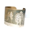 Light between the trees poetry cuff