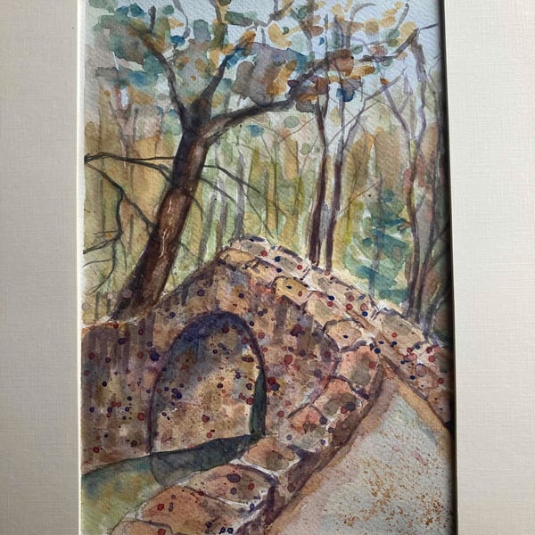 Watercolour art of stone bridge. Painting of bridge in woods. 