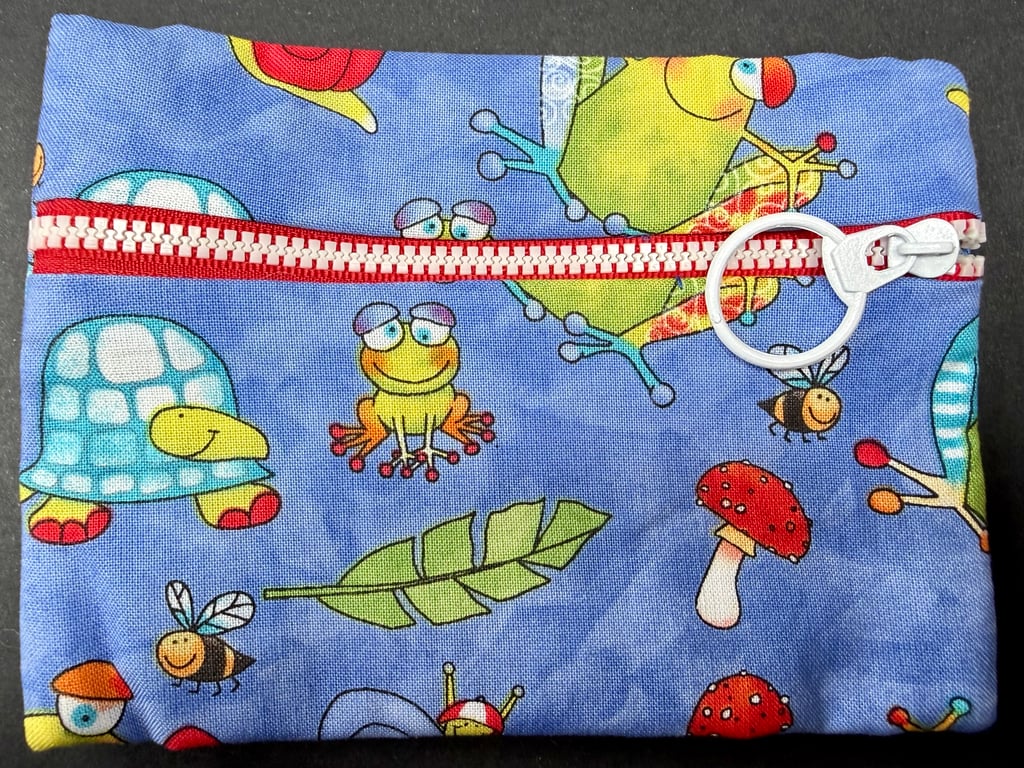 Small funky zipped pouch with cartoon frogs, tortoise, bees and toadstools