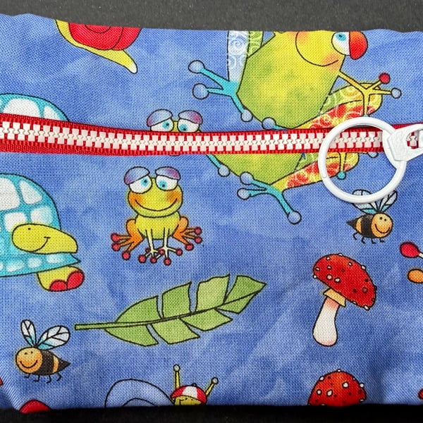 Small funky zipped pouch with cartoon frogs, tortoise, bees and toadstools
