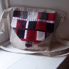 Fabric shoulder bag with patchwork textile flap and toggle fastening